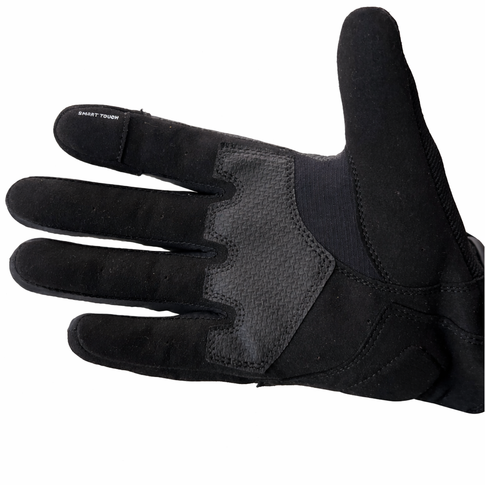 Black tactical glove on a white background
